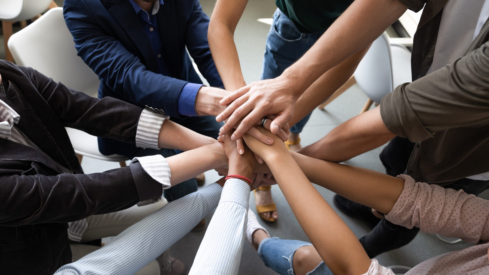The FLEET220 team joining hands in a circle